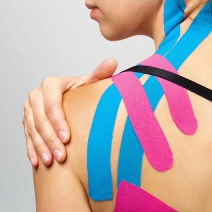 A closeup view of someone with Kinesio Taping applied to their shoulder.