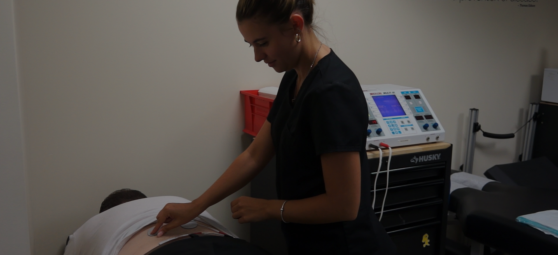 Montana is stimulating a patient in order to better relax the patient before adjustment.